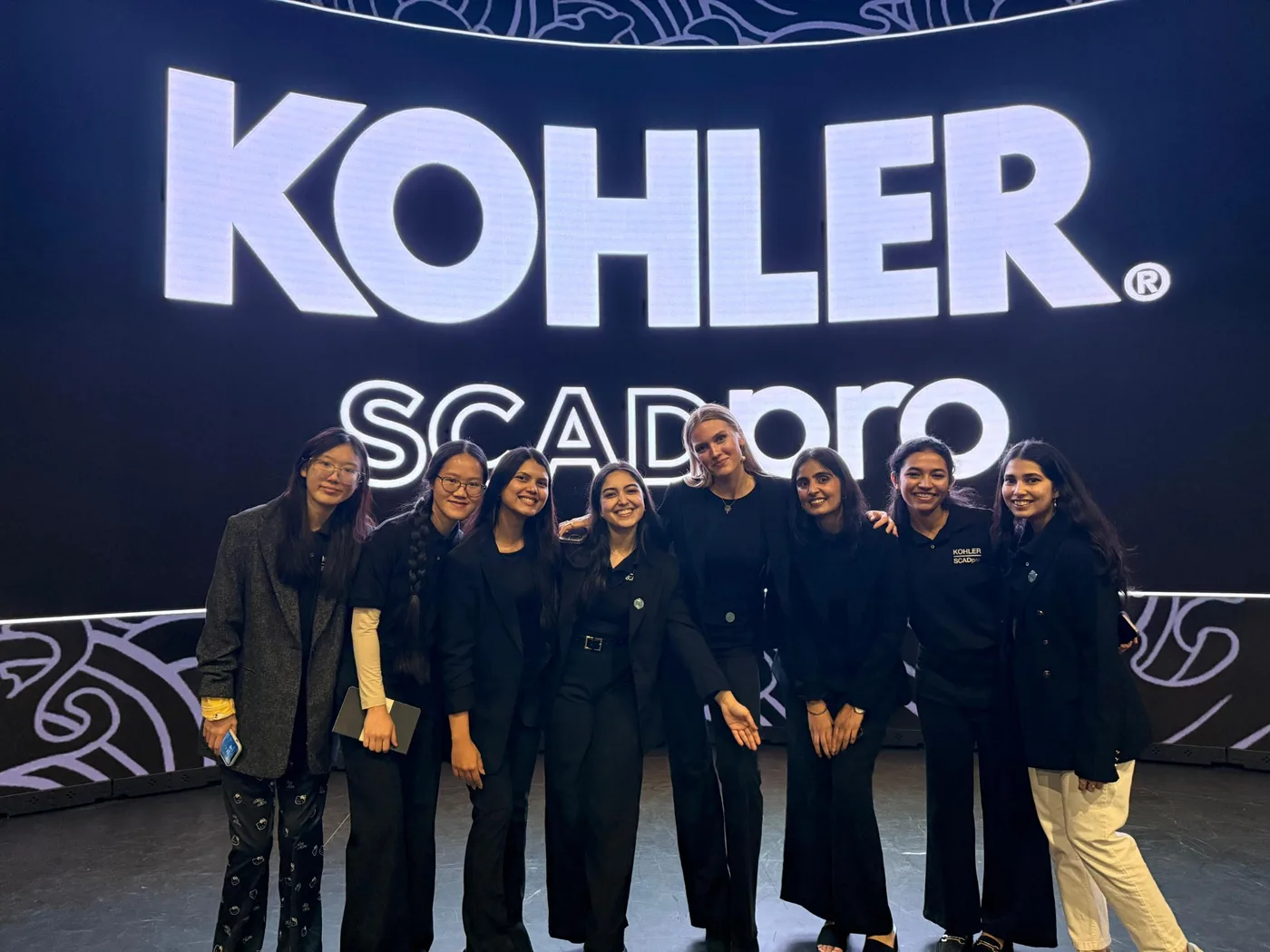 Navyaa with her SCADpro team in front of the Kohler stage.